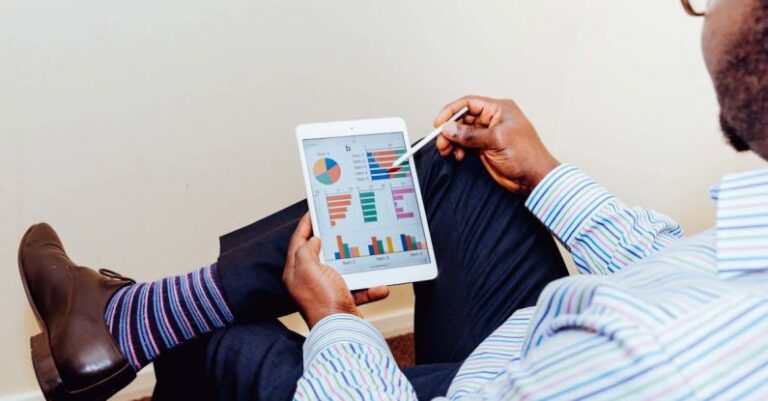 Graphics - Man Wearing White and Blue Pinstriped Dress Shirt Holding White Ipad