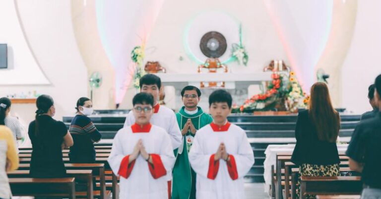 Practices - Priest and Altar Servers Performing Christian Ceremony in Church