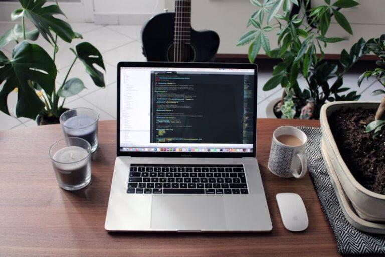 Plugins - macbook pro beside white ceramic mug on brown wooden table