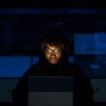 Login - Woman Wearing Black Hoodie Jacket Holding Grey Laptop Computer