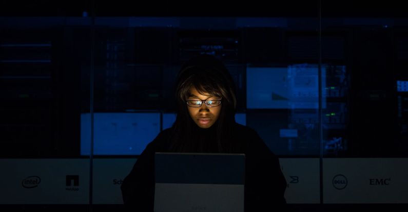 Login - Woman Wearing Black Hoodie Jacket Holding Grey Laptop Computer