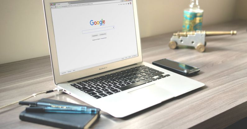 SEO - Macbook Air on Grey Wooden Table