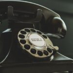 Services - Black Rotary Telephone on White Surface